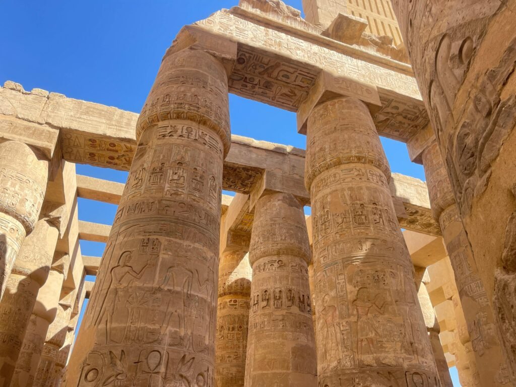 pexels-photo-31217077-31217077 Explore the intricate ancient hieroglyphs on the columns of Karnak Temple in Egypt.
